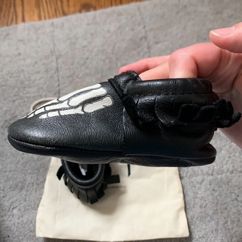 Freshly Picked Black Moccasins with White Skeleton Print